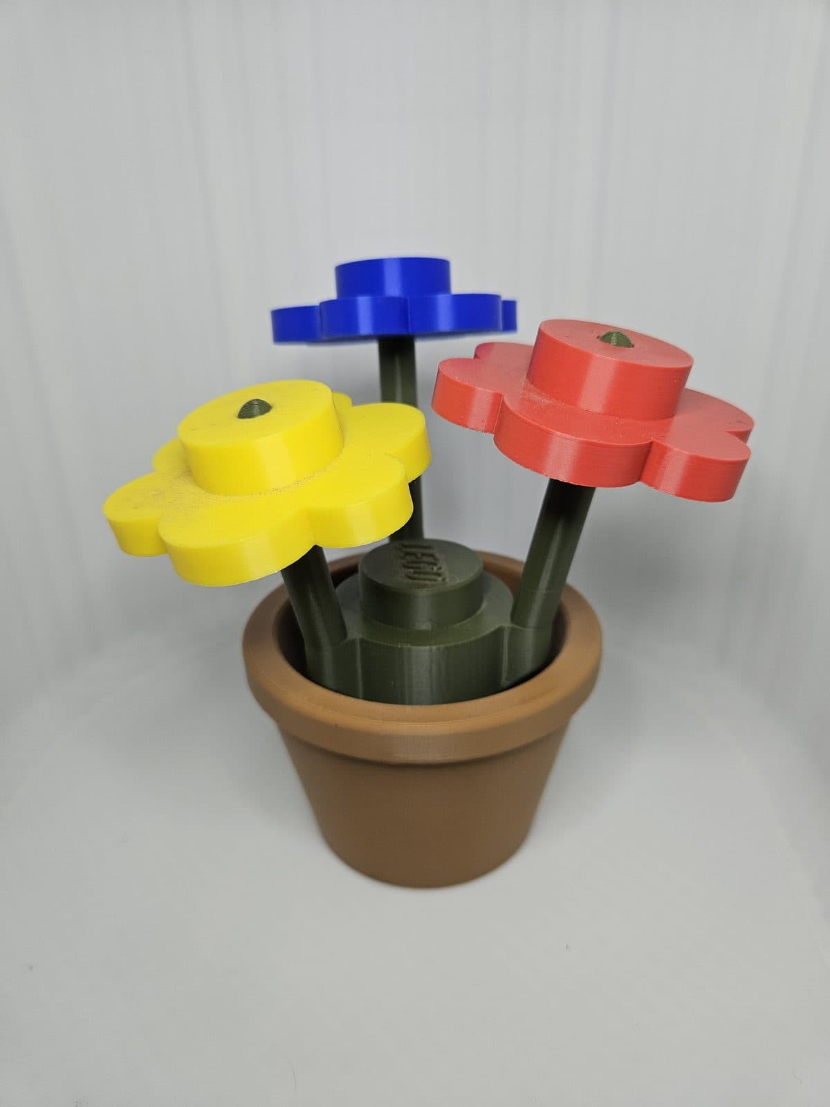 Macetero con flores tipo LEGO
